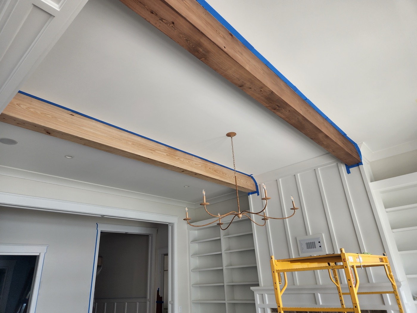 Wood beams and millwork detail added to the great room ceiling in Kary's Bluffton home