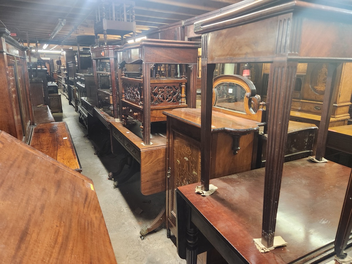 Antique furniture inside Jere's Antiques warehouse in Savannah, Georgia